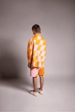 PRIVATE POLICY ORANGE AND PINK PXL CHECKER PIECING SHORTS
