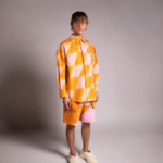 PRIVATE POLICY ORANGE AND PINK PXL CHECKER PIECING SHORTS